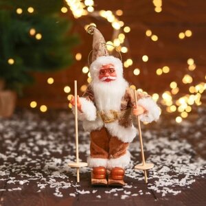 Дед Мороз 'В блестящем костюмчике, на лыжах' 16 см, золотисто-белый