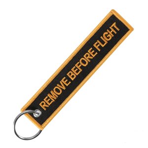 Брелок-ремувка Remove before flight, черный/оранжевый цвет